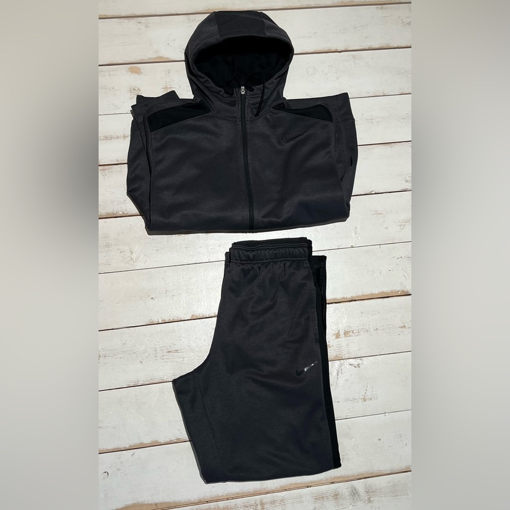 Dark gray and black zip up Nike sweat suit therma fit